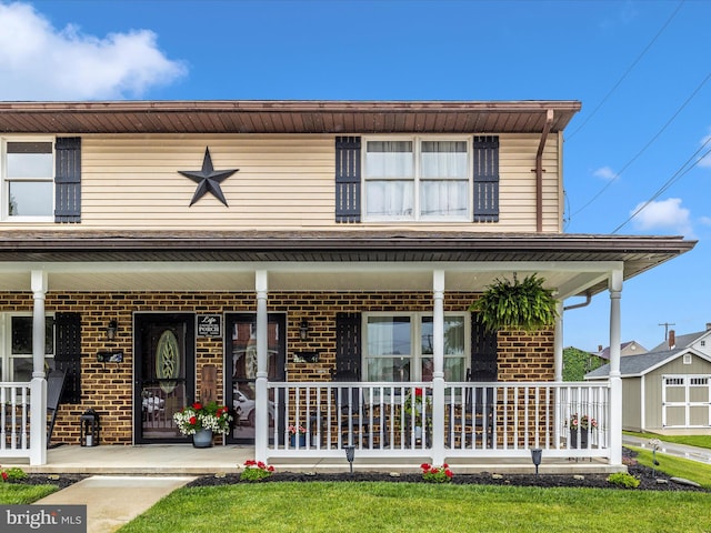 41 E Frederick St, Williamsport, MD 21795 - view of front of home featuring covered porch and brick siding