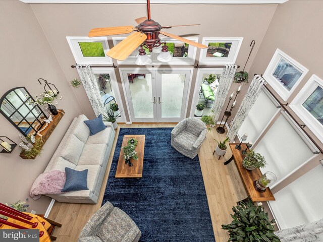 41 E Frederick St, Williamsport, MD 21795 - living area featuring wood finished floors, french doors, a towering ceiling, and a ceiling fan
