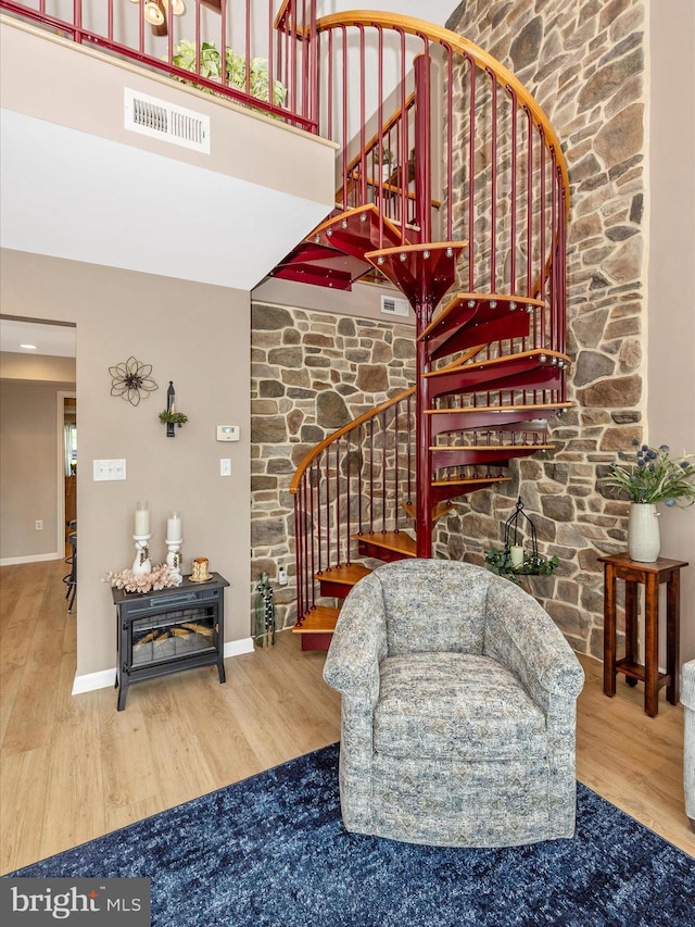 41 E Frederick St, Williamsport, MD 21795 - stairway featuring wood finished floors, a towering ceiling, and baseboards