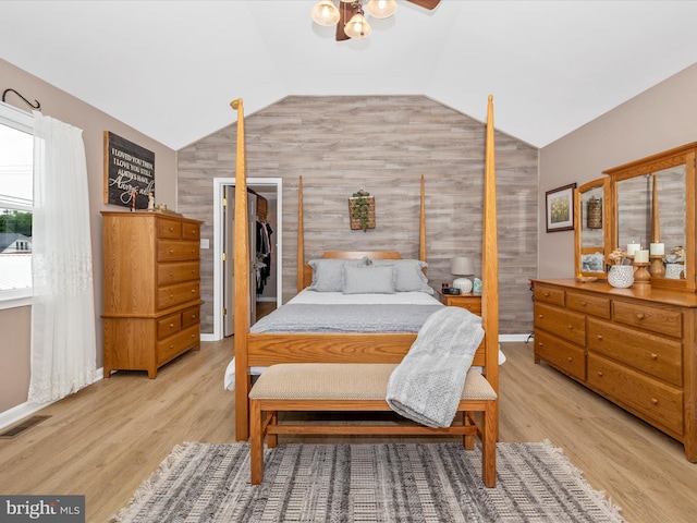 41 E Frederick St, Williamsport, MD 21795 - bedroom with lofted ceiling, light wood-style flooring, and wooden walls