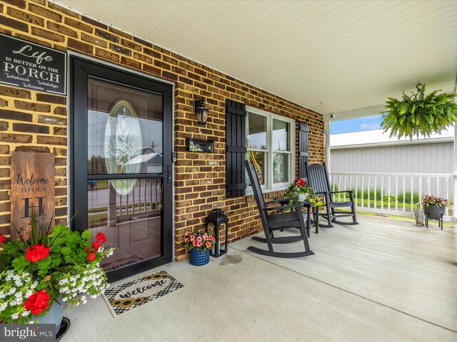 41 E Frederick St, Williamsport, MD 21795 - entrance to property with a porch and brick siding