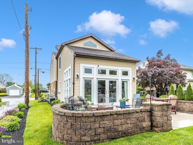 41 E Frederick St, Williamsport, MD 21795 - rear view of property featuring a patio, a lawn, and french doors