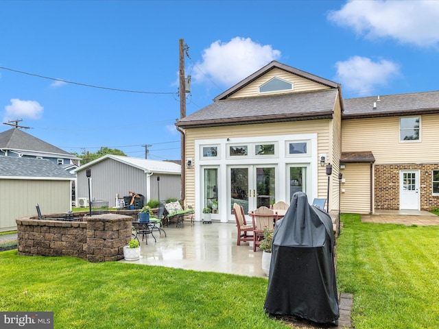 41 E Frederick St, Williamsport, MD 21795 - rear view of house with a patio, a lawn, and french doors