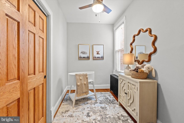 121 V St NW, Washington, DC 20001 - home office with radiator, a ceiling fan, baseboards, and light wood-type flooring