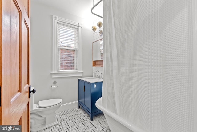 121 V St NW, Washington, DC 20001 - full bath featuring toilet, tile patterned floors, vanity, a tub, and a shower with curtain