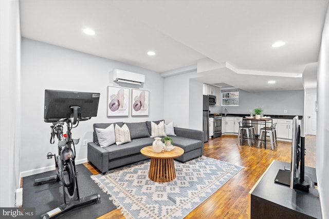 121 V St NW, Washington, DC 20001 - living room with a wall mounted AC, dark wood-style flooring, recessed lighting, bar with sink, and baseboards