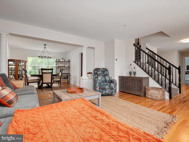 3716 Hill Park Dr, Temple Hills, MD 20748 - living room featuring ornate columns, wood finished floors, and stairway