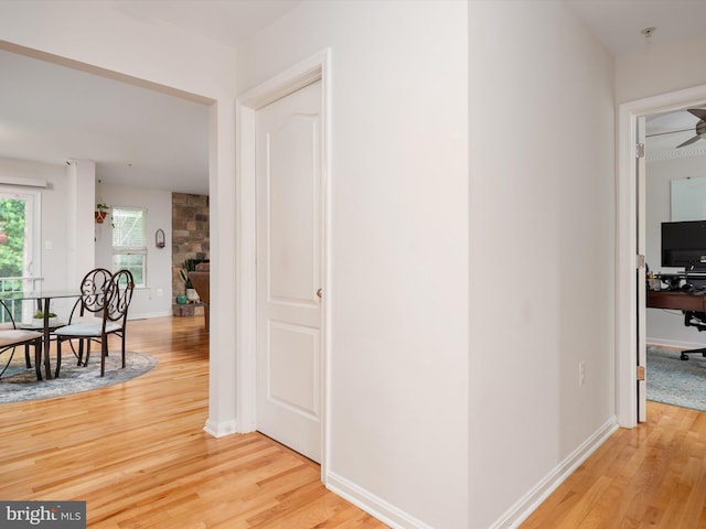 3716 Hill Park Dr, Temple Hills, MD 20748 - corridor with light wood-type flooring, baseboards, and a desk