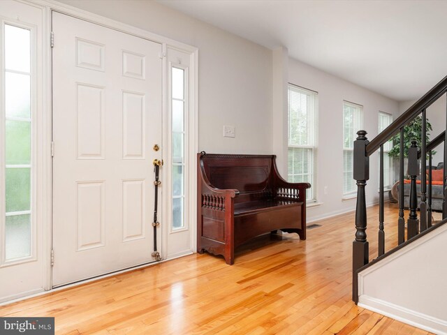 3716 Hill Park Dr, Temple Hills, MD 20748 - foyer with wood finished floors, stairway, and healthy amount of natural light