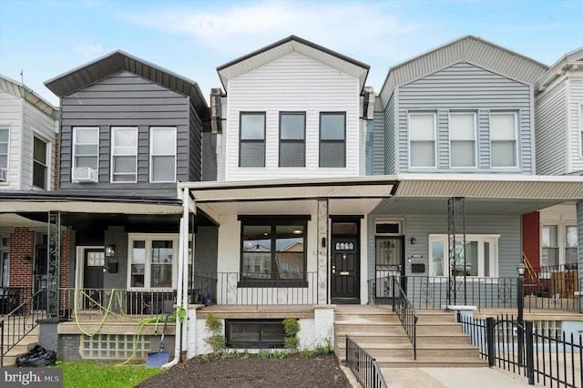1740 N 61st St, Philadelphia, PA 19151 - townhome / multi-family property featuring a porch and cooling unit