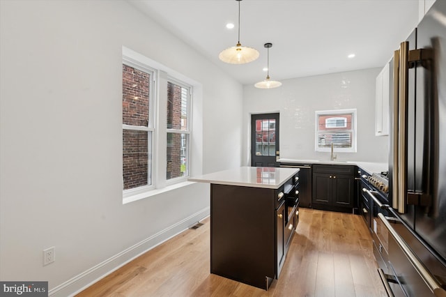 1740 N 61st St, Philadelphia, PA 19151 - kitchen featuring high end refrigerator, light wood-type flooring, a sink, dishwashing machine, and a center island