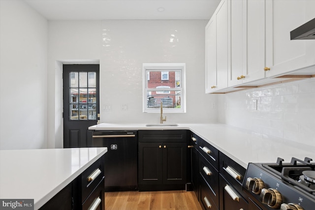 1740 N 61st St, Philadelphia, PA 19151 - kitchen featuring black appliances, a sink, white cabinets, and light countertops