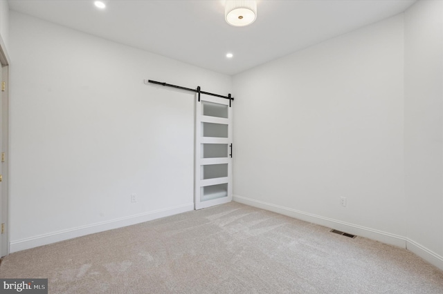 1740 N 61st St, Philadelphia, PA 19151 - spare room featuring a barn door, carpet flooring, recessed lighting, and baseboards