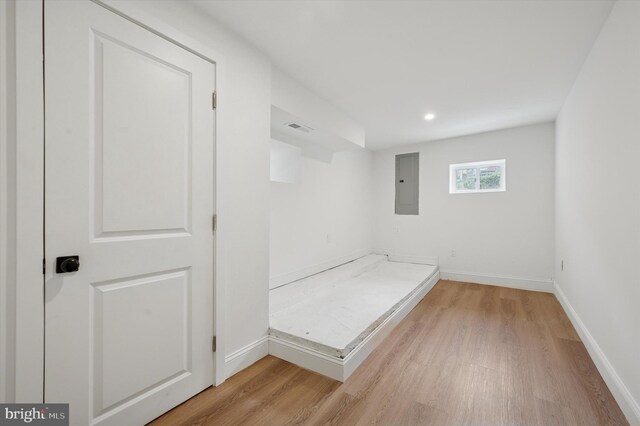 1740 N 61st St, Philadelphia, PA 19151 - unfurnished bedroom featuring electric panel, light wood-type flooring, baseboards, and recessed lighting