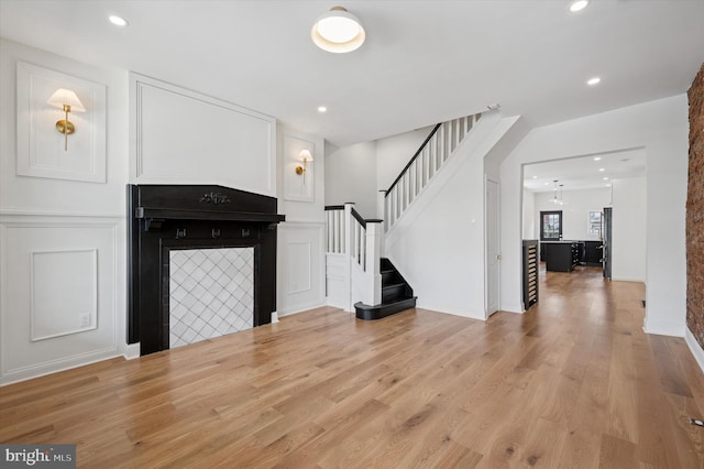 1740 N 61st St, Philadelphia, PA 19151 - unfurnished living room featuring stairway, wood finished floors, recessed lighting, and a decorative wall