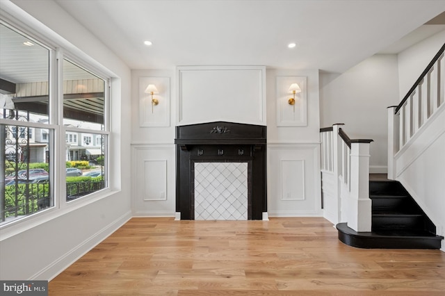 1740 N 61st St, Philadelphia, PA 19151 - unfurnished living room featuring stairs, light wood-style flooring, recessed lighting, and a decorative wall