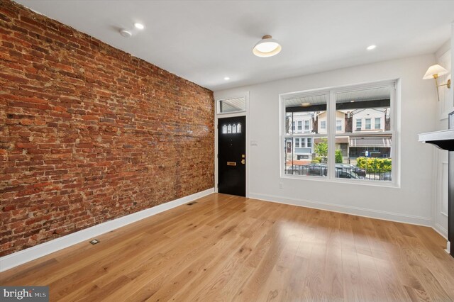 1740 N 61st St, Philadelphia, PA 19151 - foyer entrance with brick wall, baseboards, and light wood-type flooring