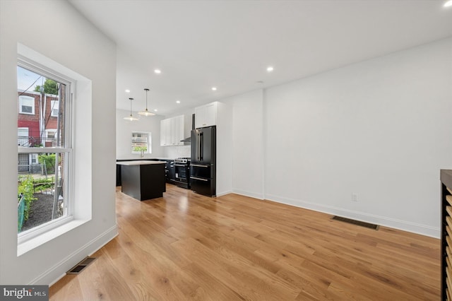 1740 N 61st St, Philadelphia, PA 19151 - unfurnished living room with light wood finished floors, recessed lighting, and baseboards