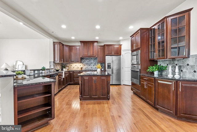 4403 Cedar Reach Ln, Bowie, MD 20720 - kitchen featuring appliances with stainless steel finishes, open shelves, backsplash, dark stone countertops, and recessed lighting