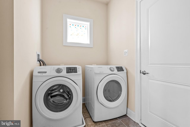 4403 Cedar Reach Ln, Bowie, MD 20720 - laundry area featuring independent washer and dryer and dark tile patterned floors