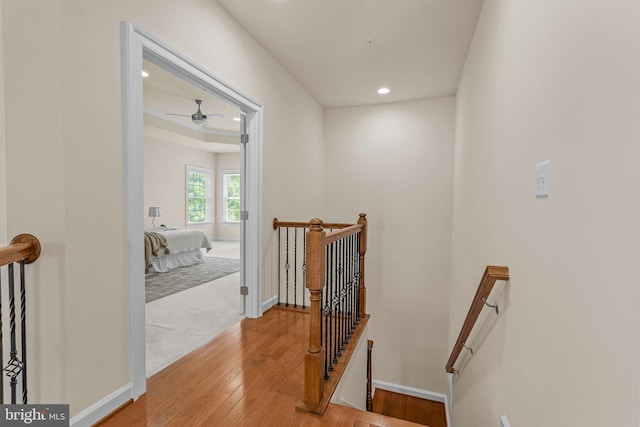 4403 Cedar Reach Ln, Bowie, MD 20720 - hallway featuring an upstairs landing, recessed lighting, and light wood-style floors