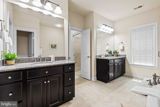 4403 Cedar Reach Ln, Bowie, MD 20720 - full bath featuring two vanities, tile patterned floors, and a spacious closet