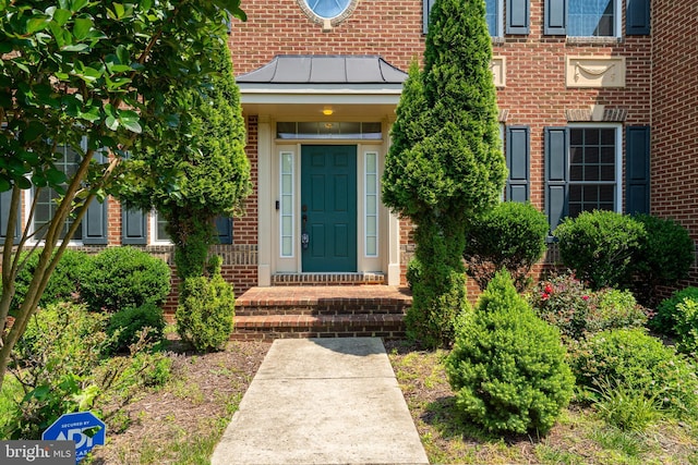 4403 Cedar Reach Ln, Bowie, MD 20720 - doorway to property featuring a standing seam roof, brick siding, and a metal roof
