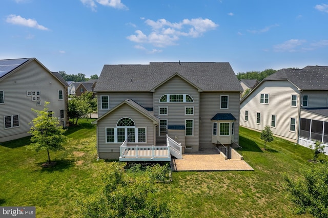 4403 Cedar Reach Ln, Bowie, MD 20720 - rear view of house with a patio, a wooden deck, a yard, and a residential view