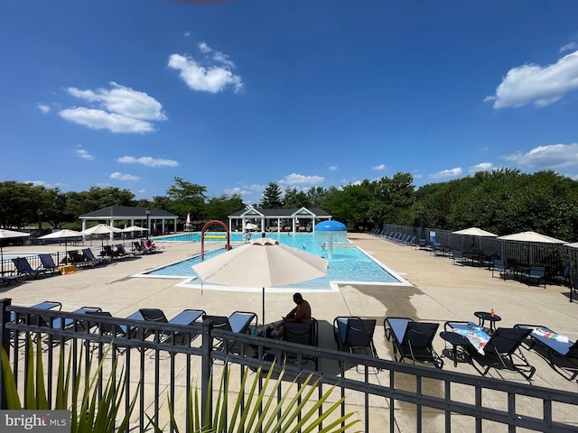 4403 Cedar Reach Ln, Bowie, MD 20720 - community pool featuring view of wooded area and a patio area