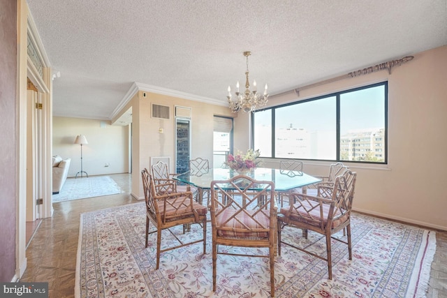 800 25th St NW Unit 801, Washington, DC 20037 - dining area featuring a chandelier, a textured ceiling, baseboards, and crown molding