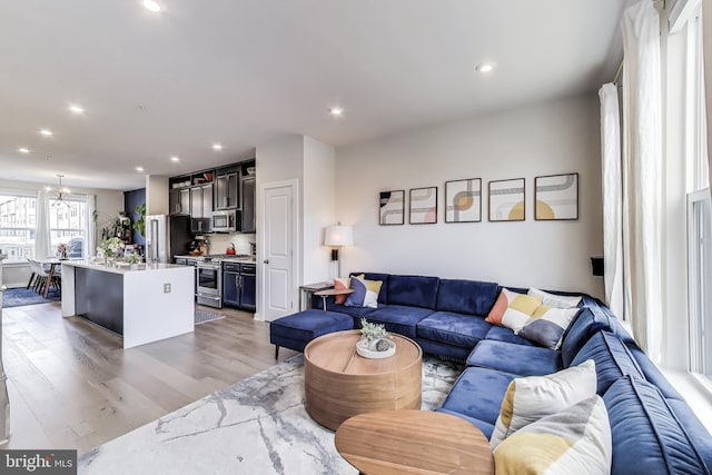 2509 River Terrace Rd, Hyattsville, MD 20782 - living area featuring light wood-style flooring, a chandelier, and recessed lighting