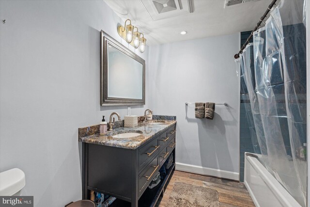 1426 Highwood Dr, Mclean, VA 22101 - bathroom featuring wood finished floors, double vanity, toilet, shower / bath combination with curtain, and baseboards