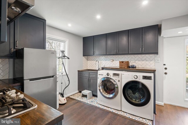 1426 Highwood Dr, Mclean, VA 22101 - washroom with washer and clothes dryer, dark wood-type flooring, baseboards, and recessed lighting
