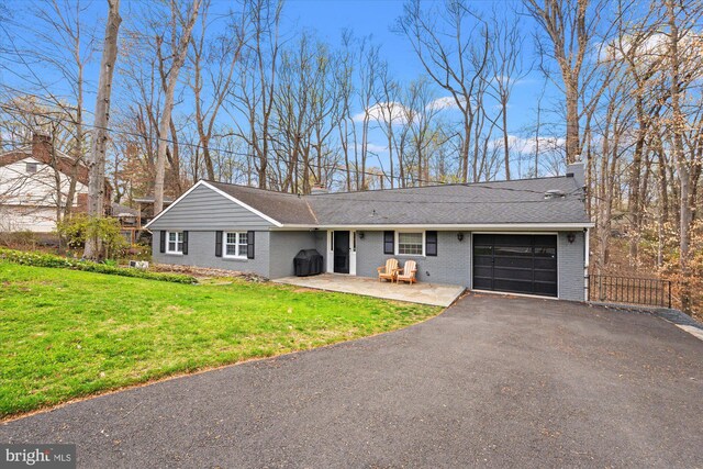1426 Highwood Dr, Mclean, VA 22101 - ranch-style house with a garage, brick siding, asphalt driveway, a chimney, and a shingled roof