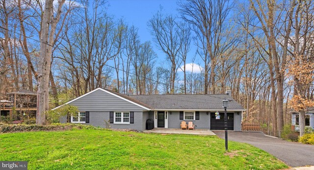 1426 Highwood Dr, Mclean, VA 22101 - ranch-style house featuring a chimney, brick siding, asphalt driveway, and an attached garage