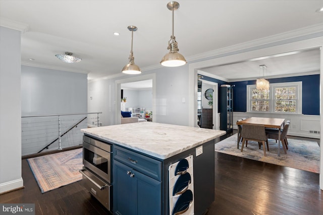 1426 Highwood Dr, Mclean, VA 22101 - kitchen with blue cabinets, dark wood-style floors, light countertops, ornamental molding, and a center island