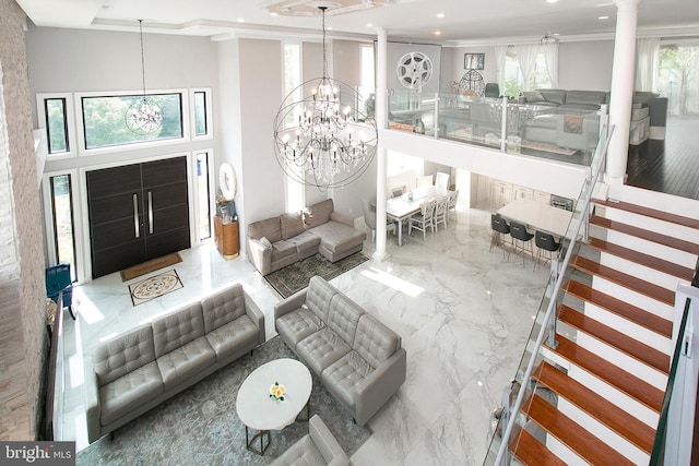 2001 Army Navy Dr, Arlington, VA 22202 - living area featuring a chandelier, recessed lighting, marble tiled flooring, ornate columns, and a high ceiling