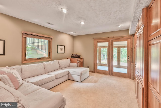 1534 Circle Dr, Annapolis, MD 21409 - living area with healthy amount of natural light, light colored carpet, and a textured ceiling
