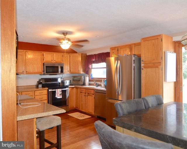 7 Caldwell Ave, Marlton, NJ 08053 - kitchen with stainless steel appliances, ceiling fan, wood finished floors, light countertops, and a sink