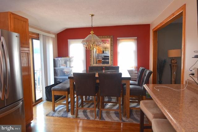 7 Caldwell Ave, Marlton, NJ 08053 - dining room with vaulted ceiling, wood finished floors, and a chandelier