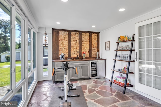 65 Hillcrest Ln, North East, MD 21901 - exercise room featuring wine cooler, stone finish floors, bar, recessed lighting, and baseboards