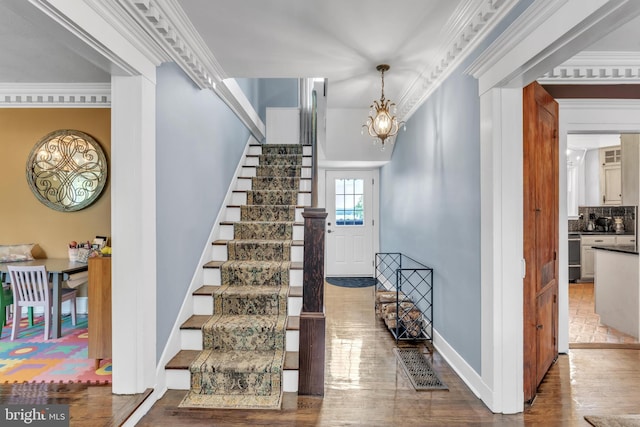 65 Hillcrest Ln, North East, MD 21901 - stairway with wood finished floors, a chandelier, and baseboards