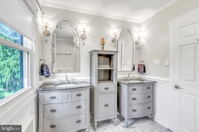 65 Hillcrest Ln, North East, MD 21901 - bathroom with two vanities, a wainscoted wall, ornamental molding, marble look tile flooring, and a decorative wall