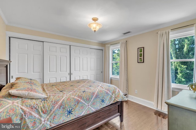 65 Hillcrest Ln, North East, MD 21901 - bedroom with a closet, baseboards, wood finished floors, and crown molding