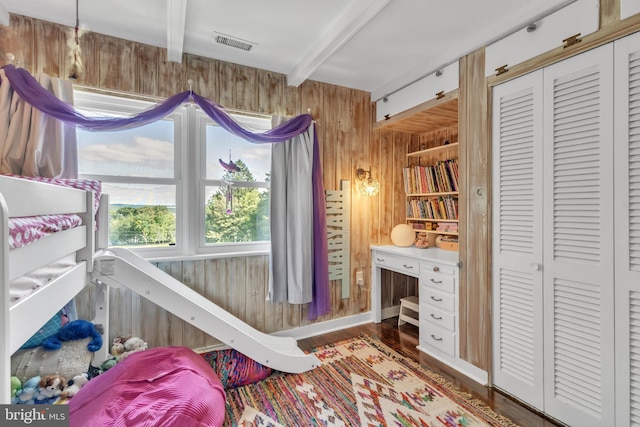 65 Hillcrest Ln, North East, MD 21901 - bedroom featuring wood walls, beamed ceiling, wood finished floors, and a closet