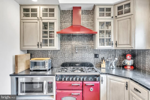 65 Hillcrest Ln, North East, MD 21901 - kitchen featuring stainless steel microwave, wall chimney range hood, dark countertops, and backsplash