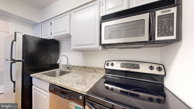 1808 Old Meadow Rd Unit 1015, Mclean, VA 22102 - kitchen featuring stainless steel appliances, a sink, white cabinets, and light stone counters