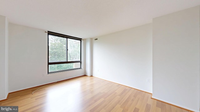 1808 Old Meadow Rd Unit 1015, Mclean, VA 22102 - empty room featuring light wood-style floors and baseboards