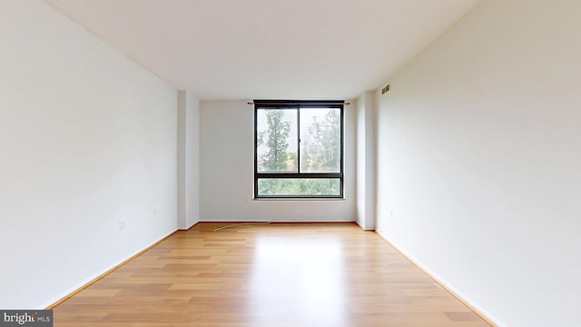 1808 Old Meadow Rd Unit 1015, Mclean, VA 22102 - empty room featuring light wood-style flooring and baseboards