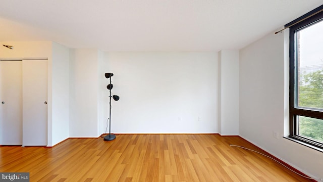 1808 Old Meadow Rd Unit 1015, Mclean, VA 22102 - unfurnished bedroom featuring light wood-style flooring, baseboards, and a closet